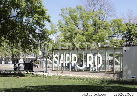 Sapporo Smiles posted at the entrance to the staircase leading to the underground shopping mall in Odori Park, Sapporo in spring Sapporo Smiles posted at the entrance to the staircase leading to the underground shopping mall in Odori Park, Sapporo in spring 126262866