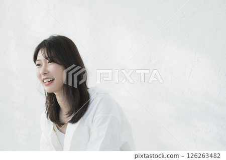 Young woman relaxing in the living room Young woman relaxing in the living room 126263482