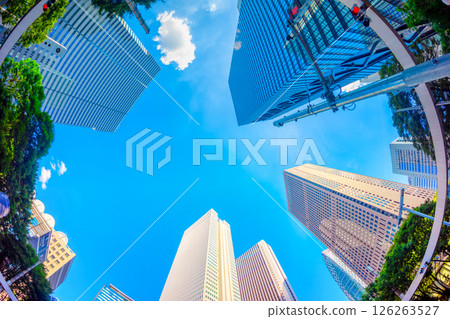 Looking up at skyscrapers against the blue sky Looking up at skyscrapers against the blue sky 126263527