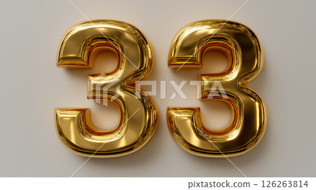 Gold metal number 33 displayed on a neutral background with reflective surfaces 126263814
