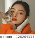 A woman who plays with a cat 126264334