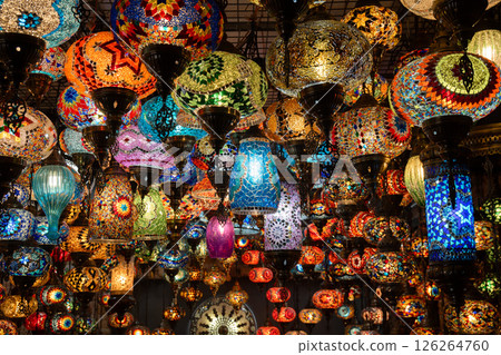 Lamps, Turkey, Bazaar: Colorful mosaic glass lamps illuminate a bustling Turkish bazaar, showcasing vibrant handcrafted artistry. 126264760