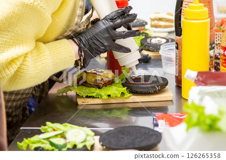 Teen Cooking Class: Making Black Burger with Sesame Bun in Cafe 126265358