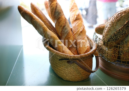 Fresh bread in a basket on a white background 126265379