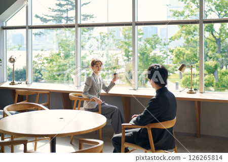 Two people chatting over coffee Two people chatting over coffee 126265814