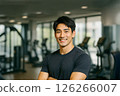 A handsome man smiling at the gym. A realistic illustration of a slim and muscular Japanese man. 126266007