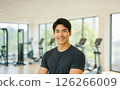 A handsome man smiling at the gym. A realistic illustration of a slim and muscular Japanese man. 126266009