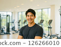 A handsome man smiling at the gym. A realistic illustration of a slim and muscular Japanese man. 126266010