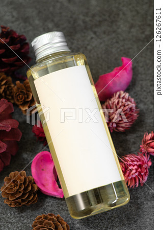 Pink potpourri and plastic cosmetic bottles 126267611