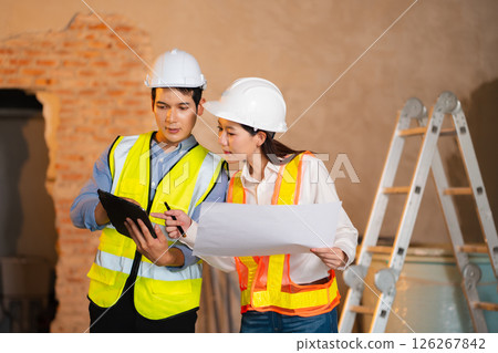 Construction engineers discussion with architects at construction site or building site Construction engineers discussion with architects at construction site or building site 126267842