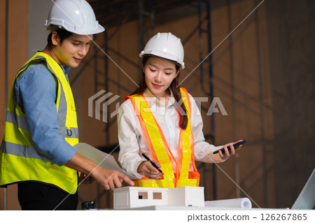 Construction engineers discussion with architects at construction site or building site Construction engineers discussion with architects at construction site or building site 126267865