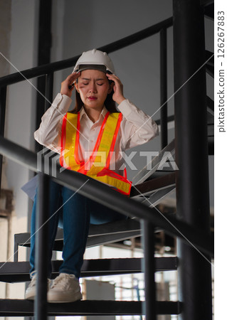 Concept of business failure and unemployment problem, unemployment stress Engineer sitting on stairs. 126267883