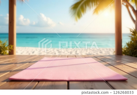 Pink yoga mat lying on wooden terrace, clear seascape blurred in background Pink yoga mat lying on wooden terrace, clear seascape blurred in background 126268033