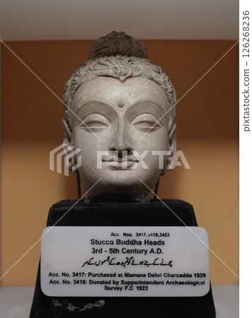 Head of a Gandhara Buddha on display at the Peshawar Museum in Pakistan 126268236