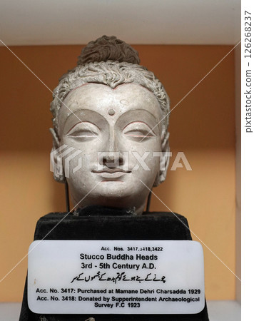 Head of a Gandhara Buddha on display at the Peshawar Museum in Pakistan 126268237