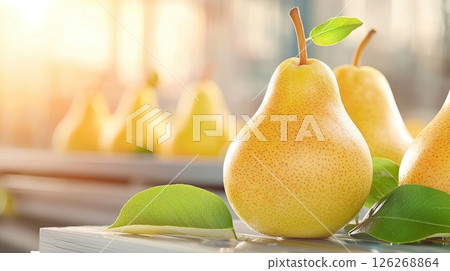 Fresh ripe pears with green leaves in sunlit setting for healthy living concept Fresh ripe pears with green leaves in sunlit setting for healthy living concept 126268864