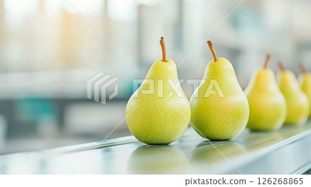 Fresh green pears on reflective surface with blurred background 126268865