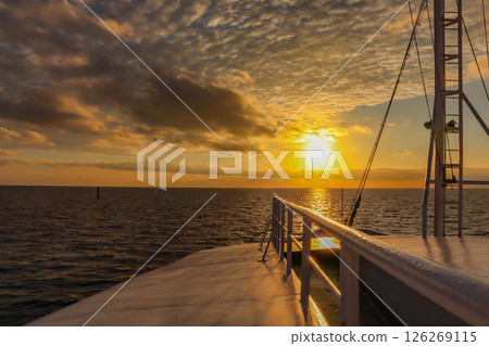 Spectacular view of the sunset and horizon from a cruise ship in Miyakojima Spectacular view of the sunset and horizon from a cruise ship in Miyakojima 126269115