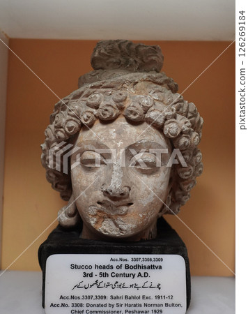 A Bodhisattva head from the Peshawar Museum in Gandhara, Pakistan, an important piece in the history of Buddhist sculpture 126269184