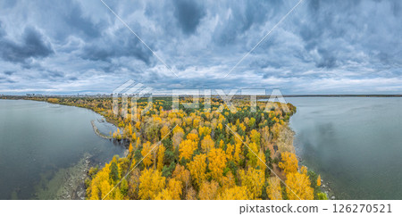 Autumn forest on lake shore at sunset and city on horizon, auerial view Autumn forest on lake shore at sunset and city on horizon, auerial view 126270521