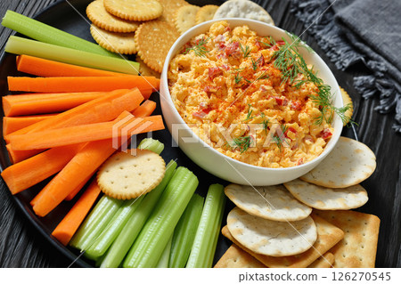 pimento cheese dip served with crackers, veggies 126270545