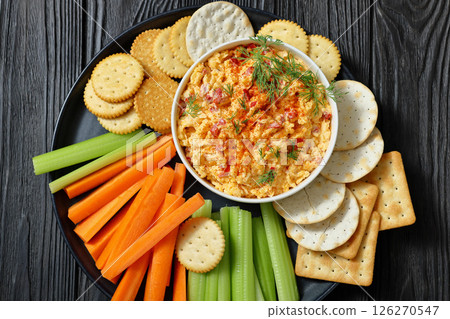 pimento cheese dip served with crackers, veggies pimento cheese dip served with crackers, veggies 126270547