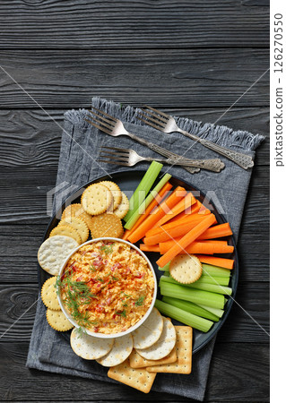 pimento cheese dip served with crackers, veggies pimento cheese dip served with crackers, veggies 126270550