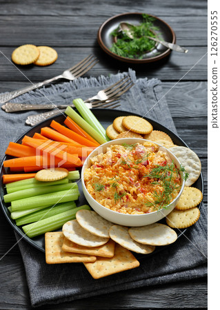 pimento cheese dip served with crackers, veggies 126270555