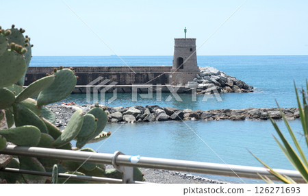 Stone old lighthouse in seafront town of Recco, Liguria. Nature, tourism and recreation, Italy. Stone old lighthouse in seafront town of Recco, Liguria. Nature, tourism and recreation, Italy. 126271693