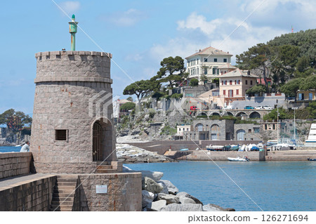 Stone old lighthouse in seafront town of Recco, Liguria. Nature, tourism and recreation, Italy. 126271694