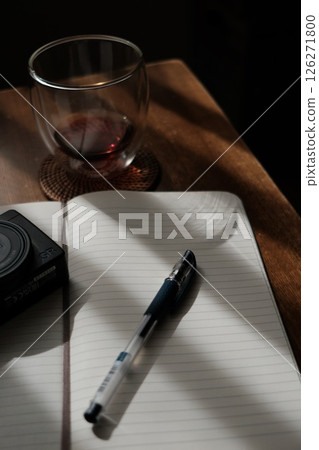Notebook, pen, glasses and camera on the desk Notebook, pen, glasses and camera on the desk 126271800