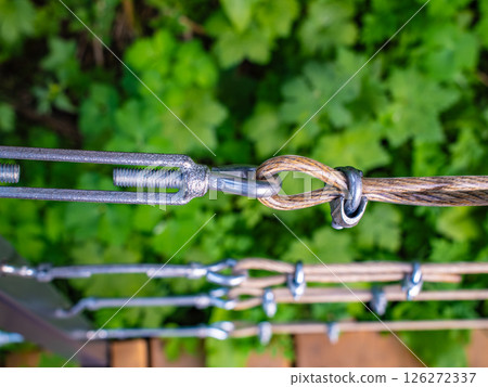 Metal turnbuckle and wire rope connection system with threaded hardware, rigging and lifting equipment for construction and marine applications, industrial fastening technology Metal turnbuckle and wire rope connection system with threaded hardware, rigging and lifting equipment for construction and marine applications, industrial fastening technology 126272337