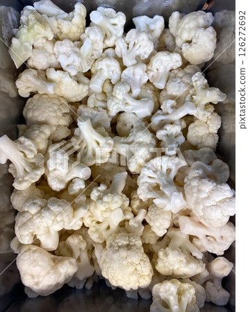White cauliflower frozen lying in the freezer at the store, vertical picture 126272692