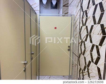 Restroom with multiple doors in the facility 126272698