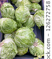 White cabbage lying on the counter at the store, vertical picture 126272758