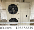 Exterior ventilation equipment on the building, helps to get rid of unstale odor in the kitchen of the premises 126272839