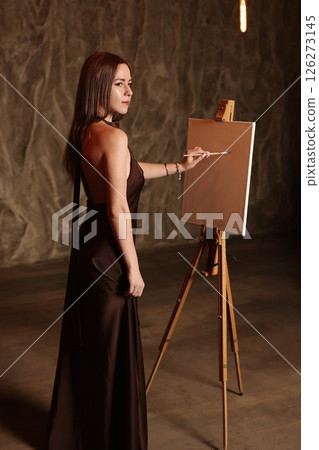 An Elegant Woman Painting in a Beautiful Artistic Studio Setting with a Creative Atmosphere 126273145