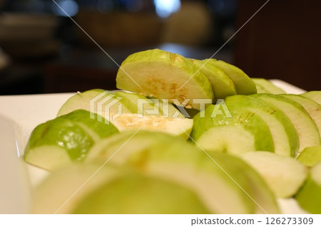 Green guava slices whole green guava close up photo Green guava slices whole green guava close up photo 126273309