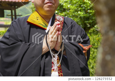 A monk praying for the dead 126273552