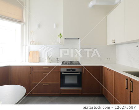 Explore Modern Kitchen Design Featuring Elegant Wooden Finishes and Exquisite Marble Accents 126273597