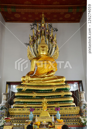 Buddha Sheltered by Naga Hood Buddha statue posture is enshrined in the western sanctuary in Wat Phra Chetuphon Wimonmangklaram or Wat Pho is popular with both tourists. Buddha Sheltered by Naga Hood Buddha statue posture is enshrined in the western sanctuary in Wat Phra Chetuphon Wimonmangklaram or Wat Pho is popular with both tourists. 126274059