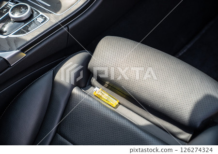 Lighter in car on hot sunny day. High temperatures in summer can cause explosions and fires 126274324