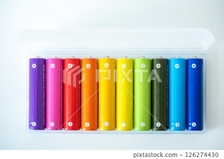 New colorful AAA battery in plastic box, rechargeable accumulator, closeup of alkaline batteries 126274430