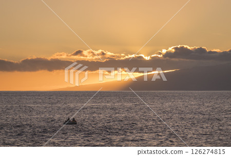 Orange sunset at sea shore promenade in Playa de San Juan, Tenerife, Spain in the south of Tenerife with fisherman boat Orange sunset at sea shore promenade in Playa de San Juan, Tenerife, Spain in the south of Tenerife with fisherman boat 126274815