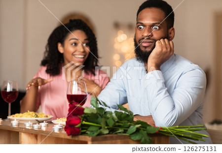 Bad Date. African American Couple Having Unsuccessful Blind Date In Restaurant, Funny Disappointed Shoked Black Man Feeling Embarrassment Listening To Excited Woman Talking Bad Date. African American Couple Having Unsuccessful Blind Date In Restaurant, Funny Disappointed Shoked Black Man Feeling Embarrassment Listening To Excited Woman Talking 126275131