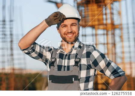 Handsome man is working on the construction site at daytime Handsome man is working on the construction site at daytime 126275558