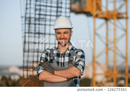 Handsome man is working on the construction site at daytime Handsome man is working on the construction site at daytime 126275561