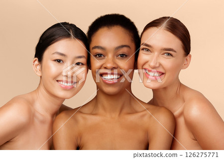 Skin And Body Care. Three Multicultural Ladies Models Posing Smiling At Camera On Beige Studio Background 126275771