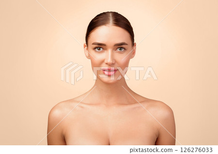 Pretty Shirtless Woman Posing Looking At Camera Standing Over Gray Studio Background. Portrait Of Perfect Beautiful Young Lady. Female Sensuality And Natural Beauty. Body Care Concept 126276033
