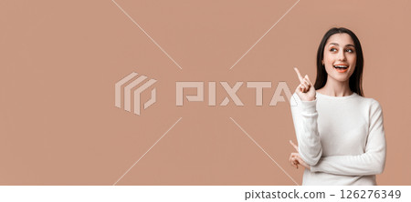 Great Idea. Young Latin Woman Pointing Finger Up, Having Problem Solution, Posing Over Yellow Background With Empty Space, Panorama Great Idea. Young Latin Woman Pointing Finger Up, Having Problem Solution, Posing Over Yellow Background With Empty Space, Panorama 126276349